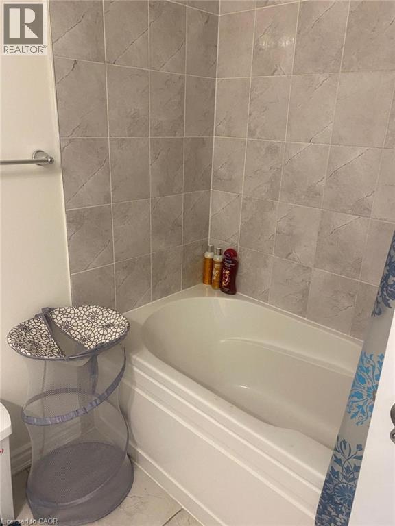 Bathroom with a bath - 128 Watermill Street, Kitchener, ON - Indoor Photo Showing Bathroom