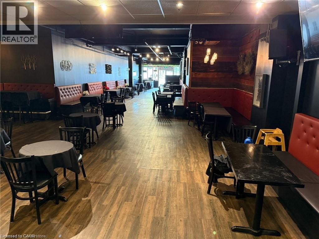 Dining room featuring wood finished floors - 179 King Street W, Kitchener, ON