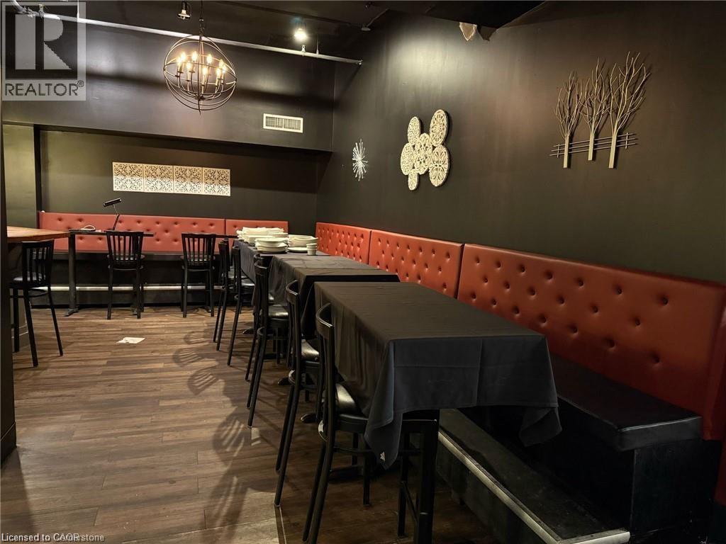 Dining room with wood finished floors - 179 King Street W, Kitchener, ON