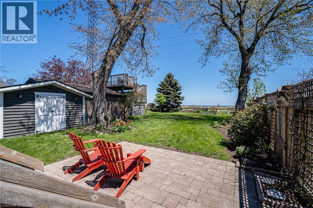 View of patio featuring a shed and lake views - 849 Beach Boulevard, Hamilton, ON - Outdoor