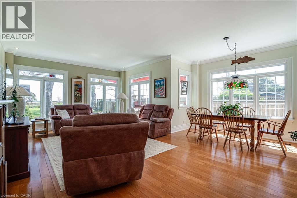 Living area featuring crown molding, plenty of natural light, and hardwood / wood-style flooring - 849 Beach Boulevard, Hamilton, ON - Indoor Photo Showing Living Room