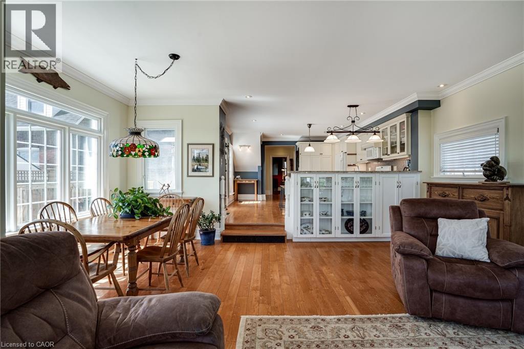 Living area featuring hardwood / wood-style flooring and crown molding - 849 Beach Boulevard, Hamilton, ON - Indoor Photo Showing Living Room