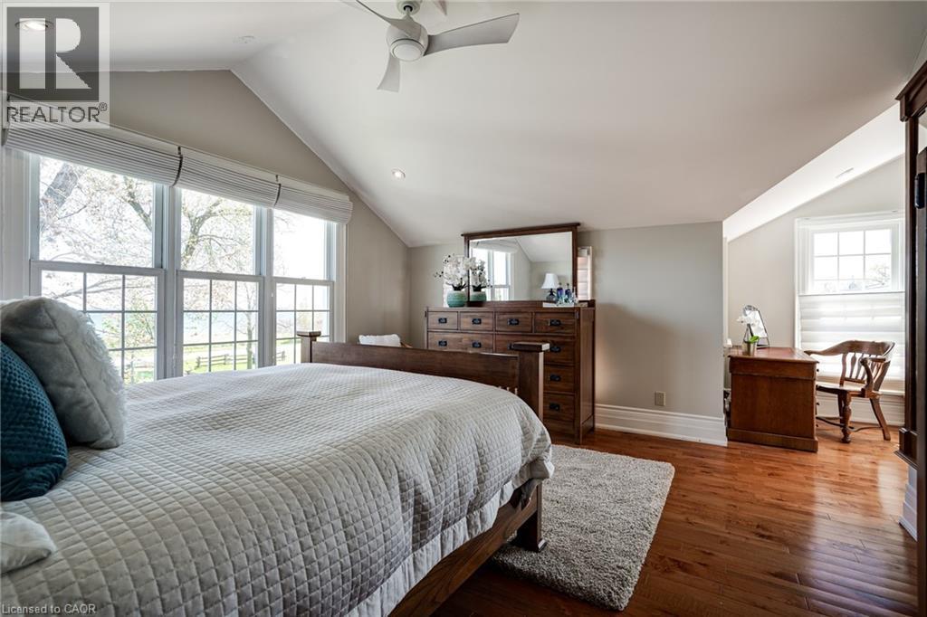 Bedroom featuring lofted ceiling, hardwood / wood-style floors, a ceiling fan, and recessed lighting - 849 Beach Boulevard, Hamilton, ON - Indoor Photo Showing Bedroom