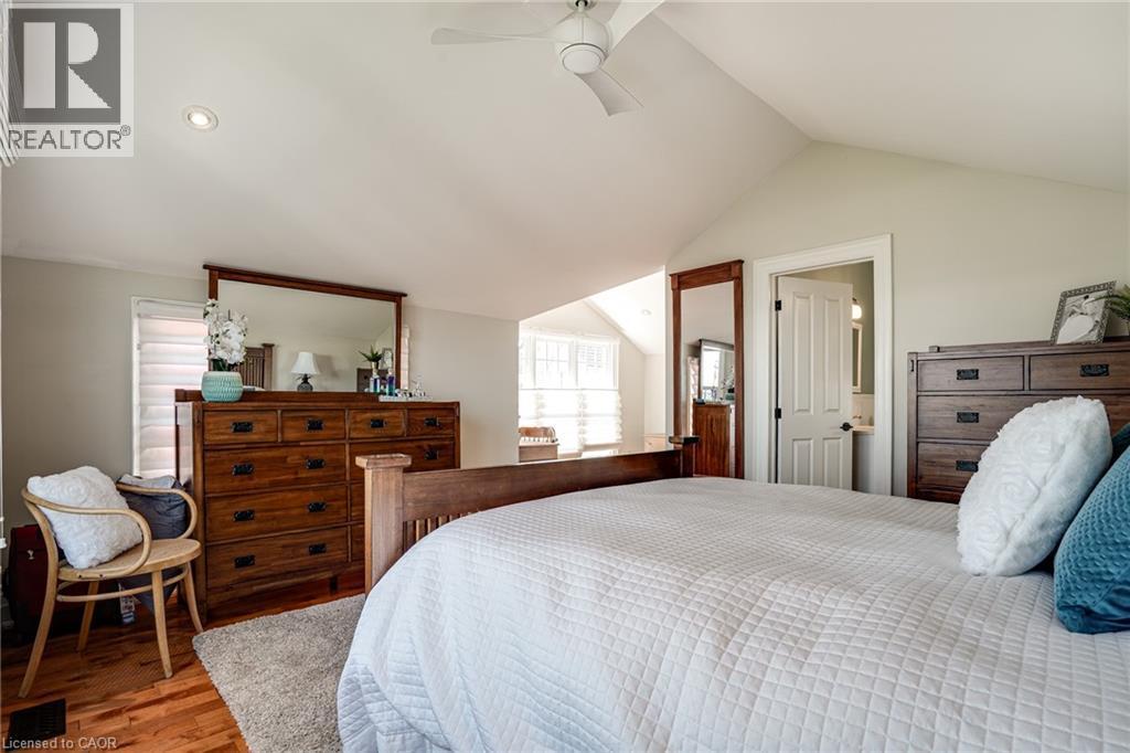 Bedroom featuring vaulted ceiling, wood finished floors, and ceiling fan - 849 Beach Boulevard, Hamilton, ON - Indoor Photo Showing Bedroom