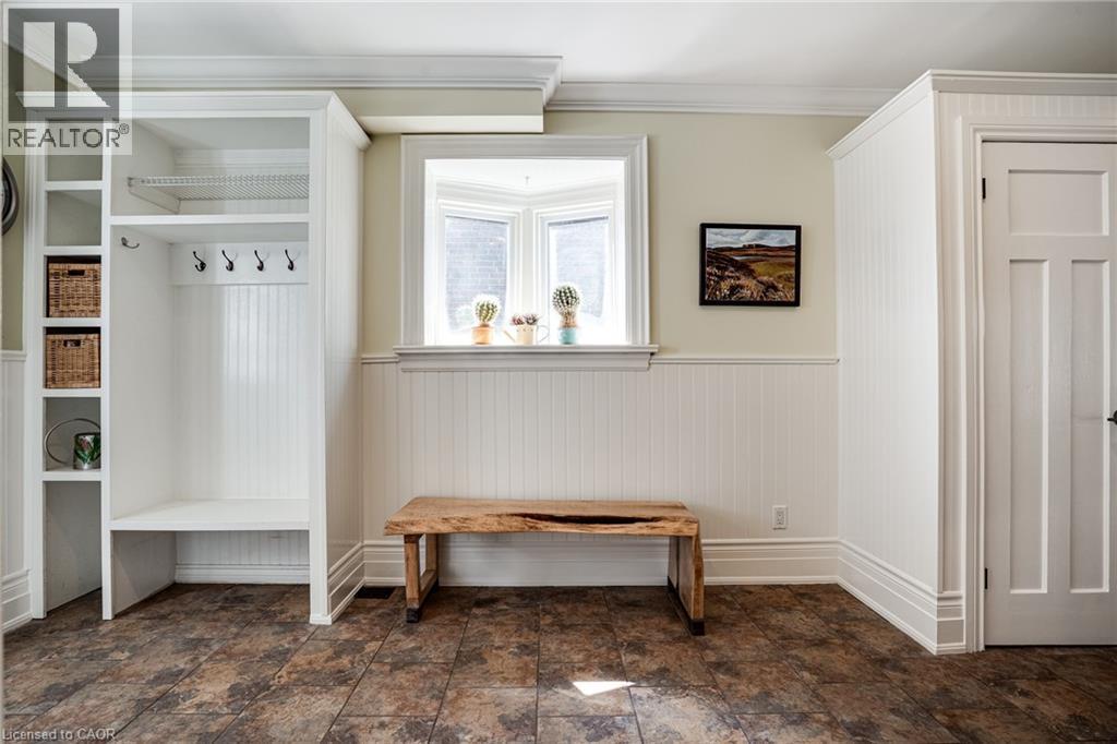 Mudroom featuring wainscoting, ornamental molding, and stone finish flooring - 849 Beach Boulevard, Hamilton, ON - Indoor Photo Showing Other Room