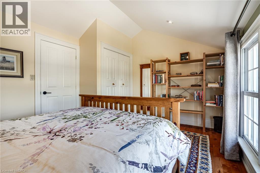 Bedroom #2 featuring dark wood-style flooring, a closet, and vaulted ceiling - 849 Beach Boulevard, Hamilton, ON - Indoor Photo Showing Bedroom