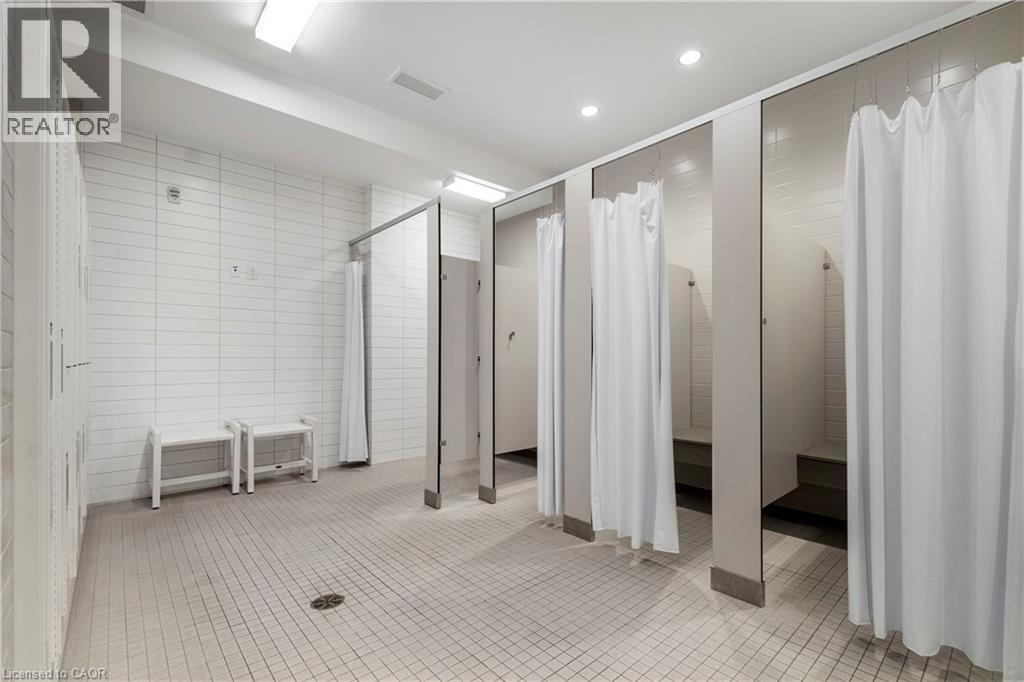 Changerooms outside pool area located within St. Elizabeth Village - 25 Jaczenko Terrace, Hamilton, ON - Indoor Photo Showing Other Room