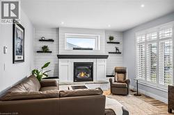 Upgraded and custom built gas fireplace and built-ins -