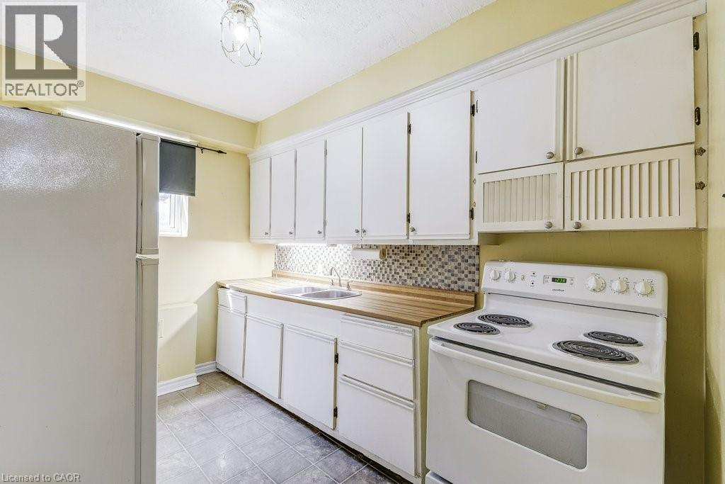 2418 New Street Unit# 1, Burlington, ON - Indoor Photo Showing Kitchen With Double Sink