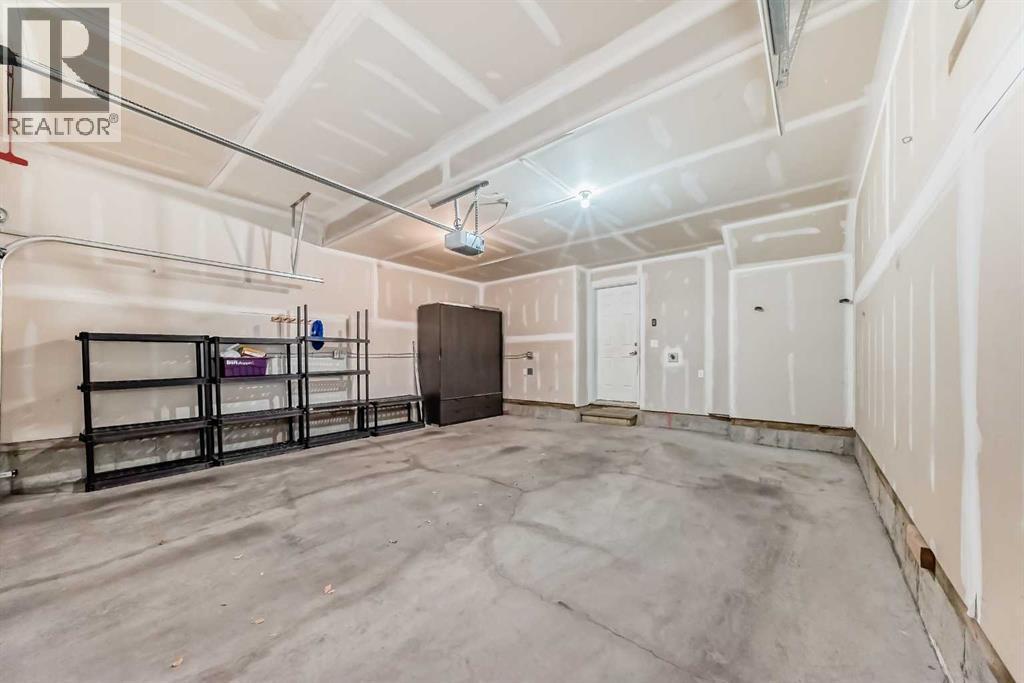 238 Panatella Nw, Calgary, AB - Indoor Photo Showing Garage