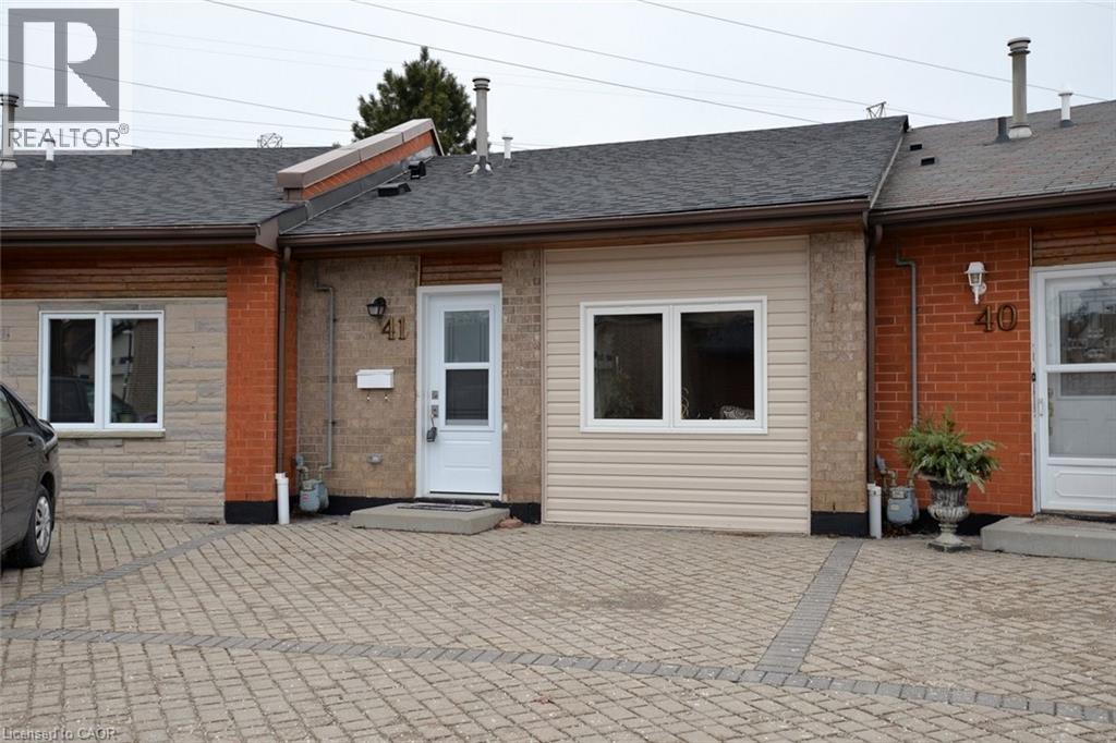 Rear view of property with roof with shingles and brick siding - 41 Sister Kern Terrace, Hamilton, ON - Outdoor With Exterior