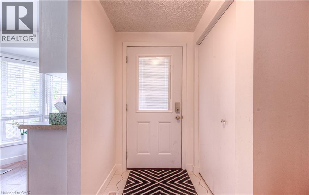 Entryway with plenty of natural light and a textured ceiling - 236 Bankside Drive, Kitchener, ON - Indoor Photo Showing Other Room