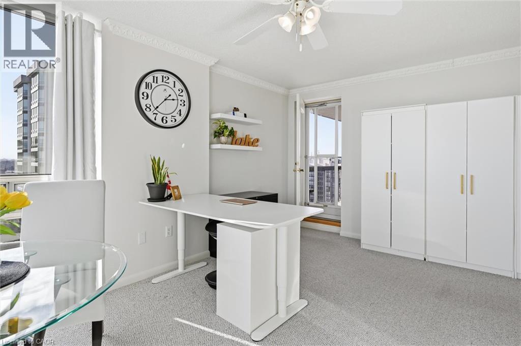 Office space featuring light colored carpet, crown molding, and ceiling fan - 2170 Marine Drive Unit# 1808, Oakville, ON - Indoor
