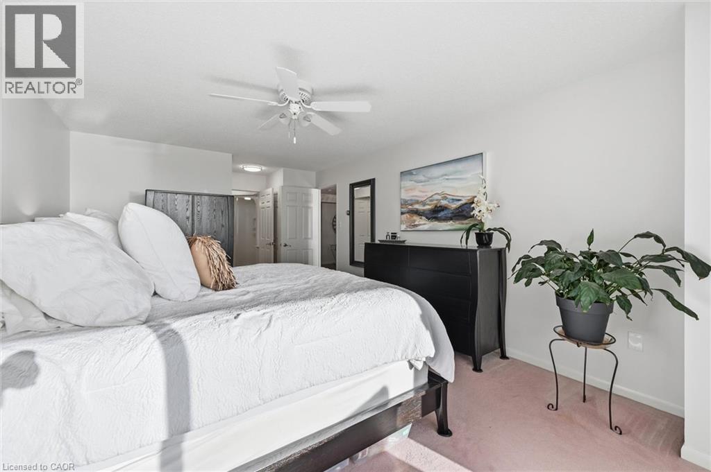 Bedroom with light carpet and ceiling fan - 2170 Marine Drive Unit# 1808, Oakville, ON - Indoor Photo Showing Bedroom