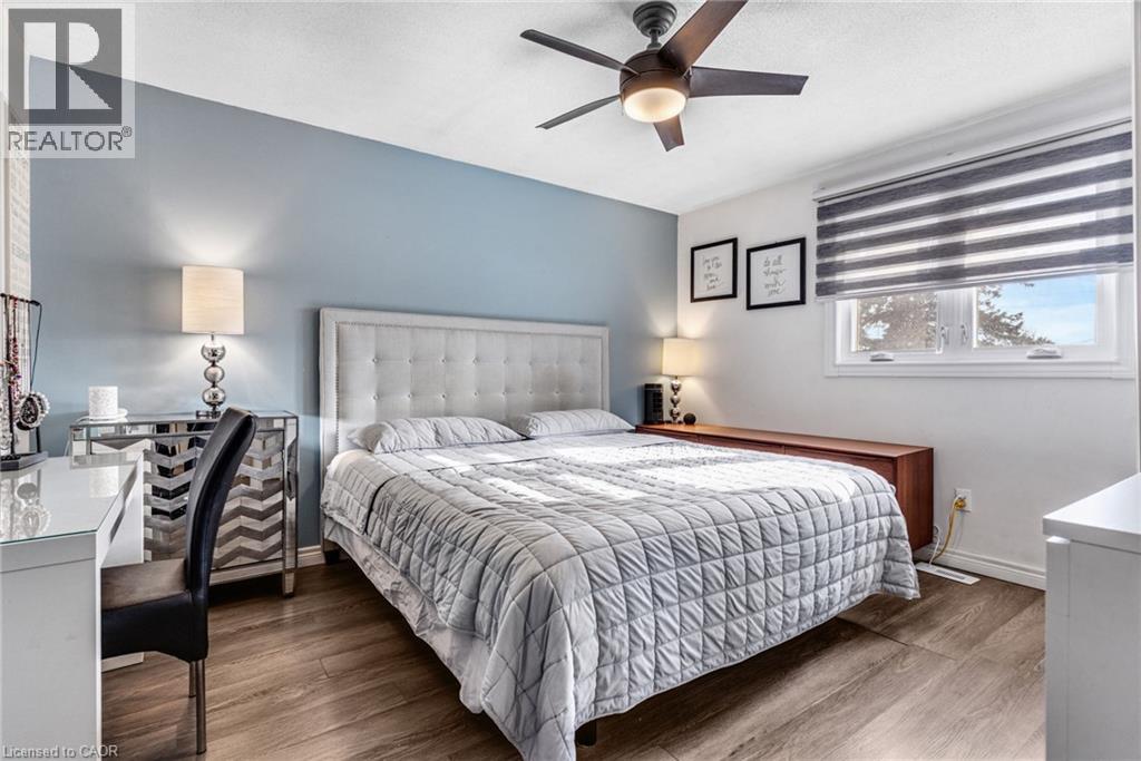 Bedroom featuring wood finished floors and a ceiling fan - 136 Limpert Avenue, Cambridge, ON - Indoor Photo Showing Bedroom