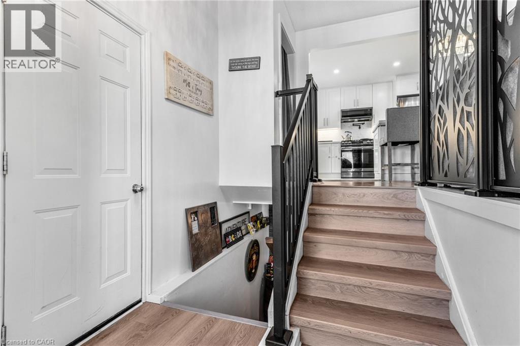 Stairs featuring wood finished floors and recessed lighting - 136 Limpert Avenue, Cambridge, ON - Indoor Photo Showing Other Room