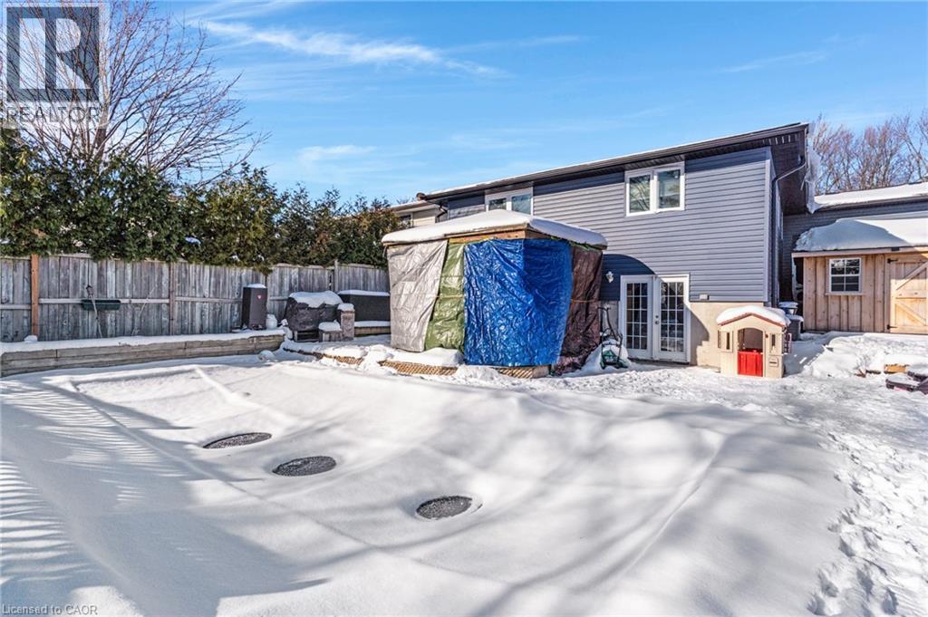 Snow covered rear of property with an outbuilding and french doors - 136 Limpert Avenue, Cambridge, ON - Outdoor