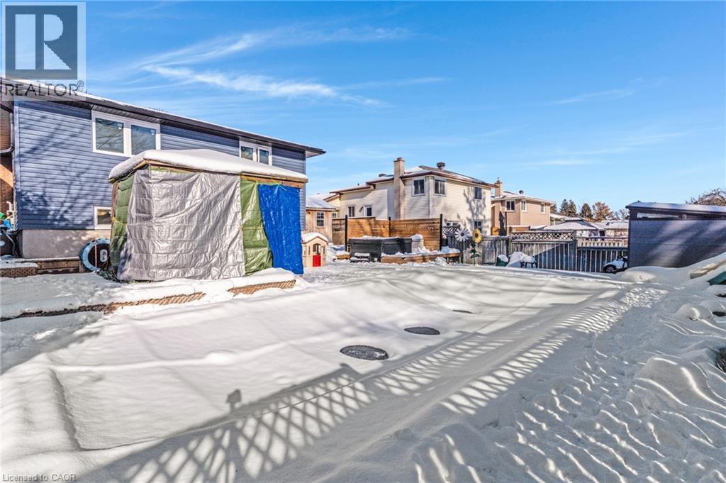 Snow covered patio with a residential view - 136 Limpert Avenue, Cambridge, ON - Outdoor