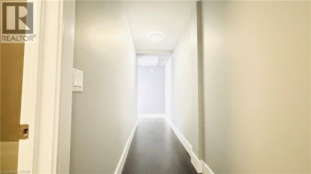 Corridor featuring baseboards - 155 St. Leger Unit# 107, Kitchener, ON - Indoor Photo Showing Other Room