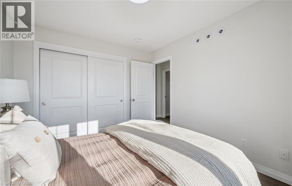 Bedroom with baseboards and a closet - 24 Morrison Road Unit# D9, Kitchener, ON - Indoor Photo Showing Bedroom