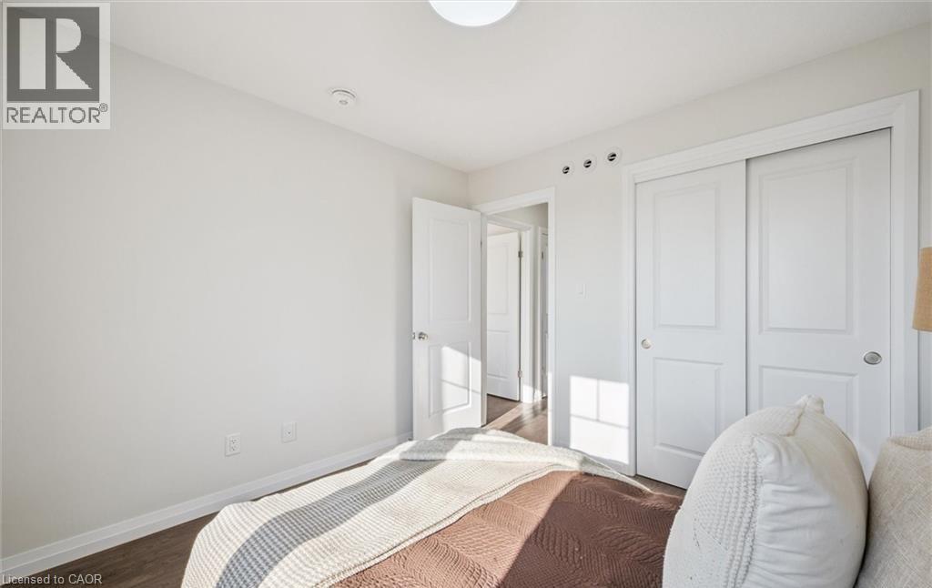 Bedroom featuring a closet and wood finished floors - 24 Morrison Road Unit# D9, Kitchener, ON - Indoor Photo Showing Bedroom