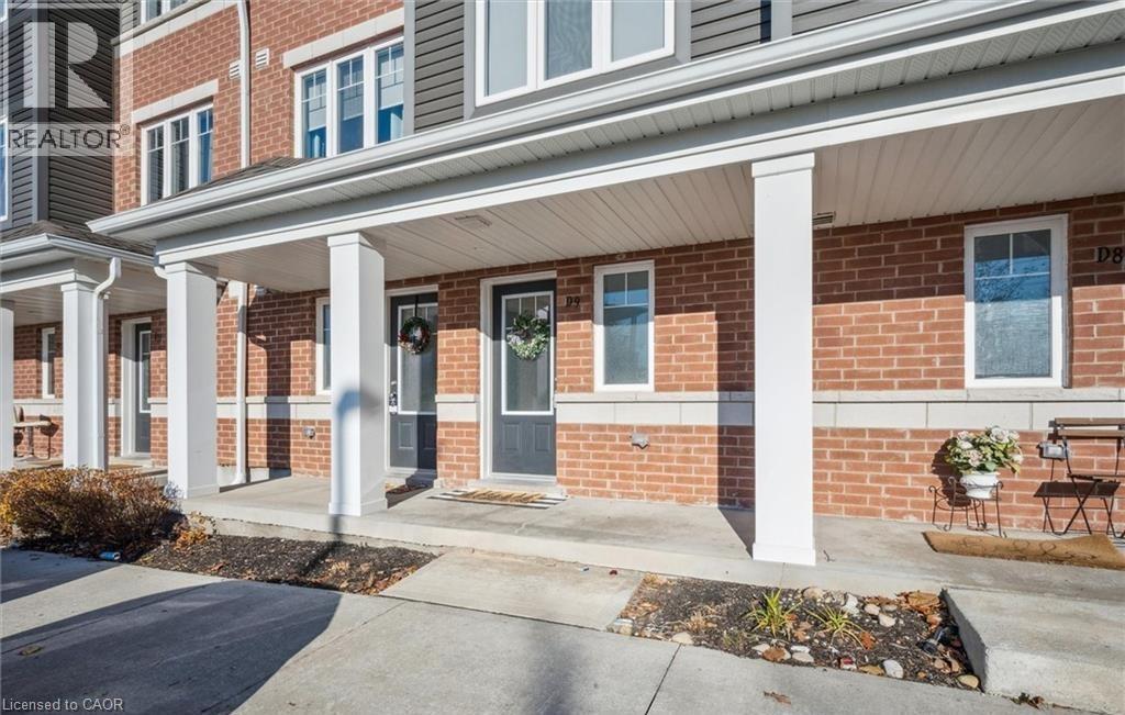 Entrance to property featuring covered porch and brick siding - 24 Morrison Road Unit# D9, Kitchener, ON - Outdoor With Facade