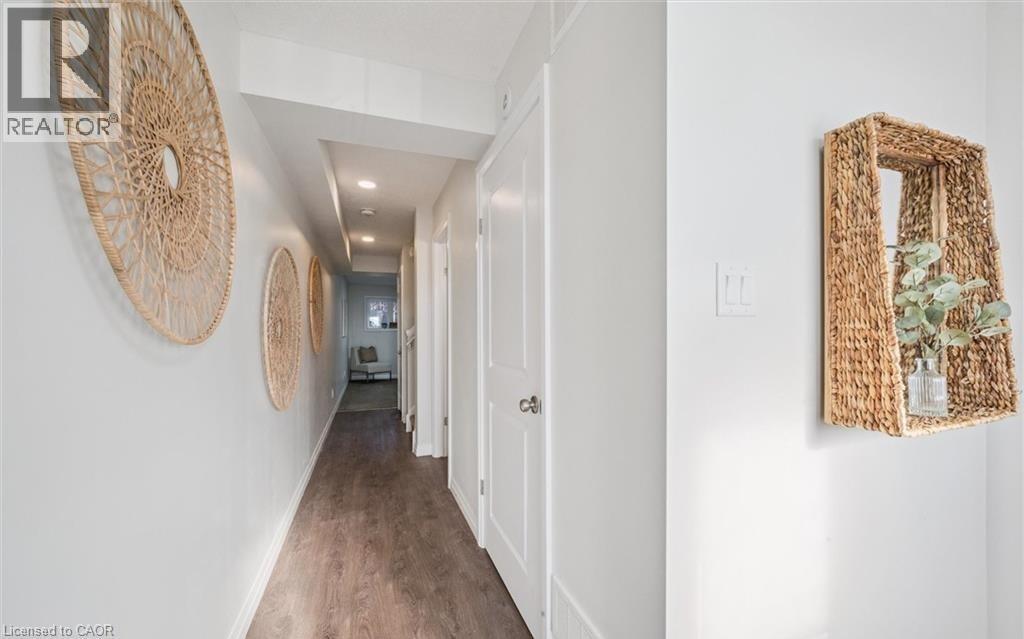 Corridor featuring wood finished floors and recessed lighting - 24 Morrison Road Unit# D9, Kitchener, ON - Indoor Photo Showing Other Room