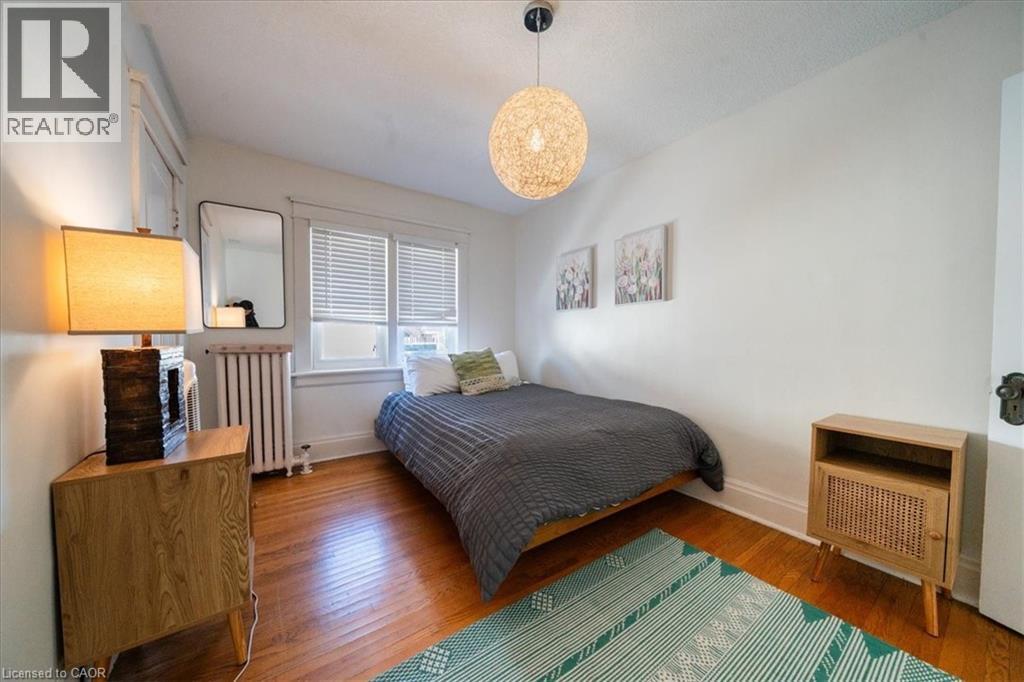 Bedroom with radiator and wood-type flooring - 184 Weber Street E, Kitchener, ON - Indoor Photo Showing Bedroom
