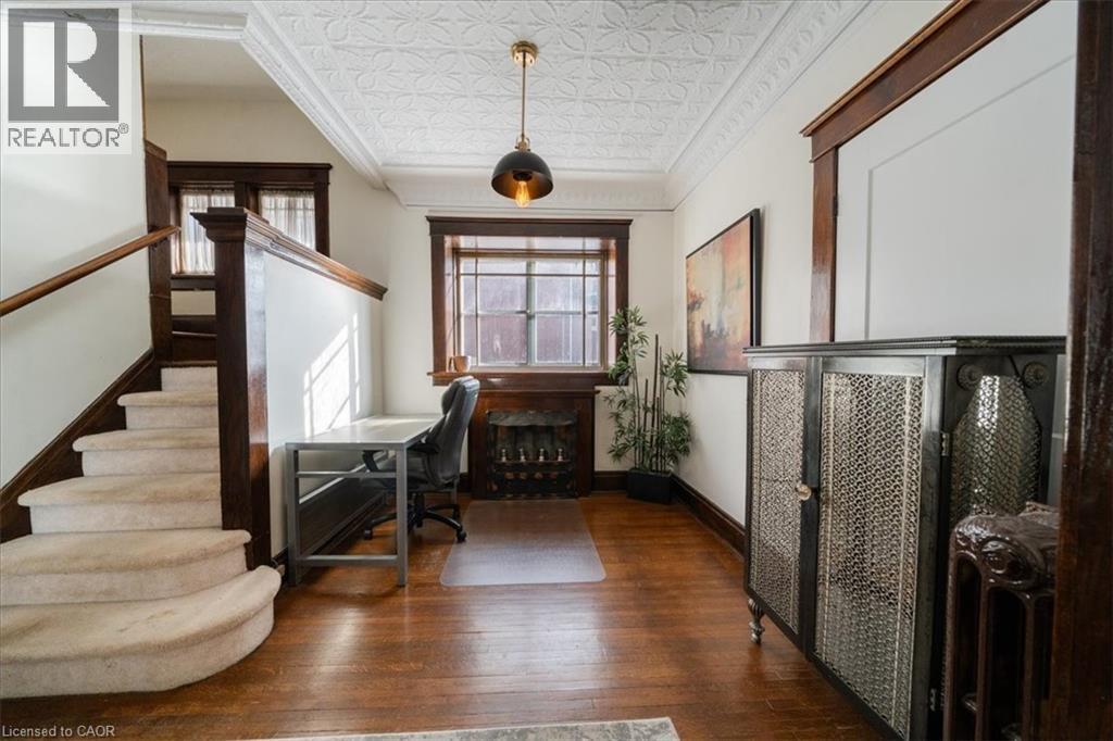 Office space with an ornate ceiling, dark wood finished floors, and crown molding - 184 Weber Street E, Kitchener, ON - Indoor Photo Showing Other Room