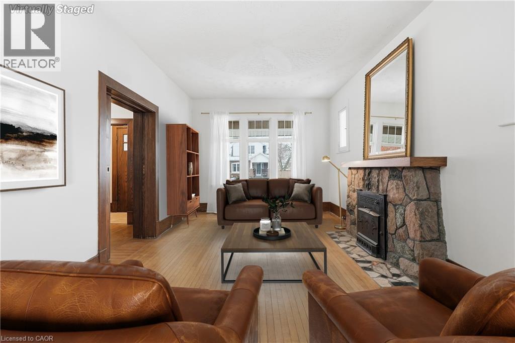 110 Houghton Avenue S, Hamilton, ON - Indoor Photo Showing Living Room With Fireplace