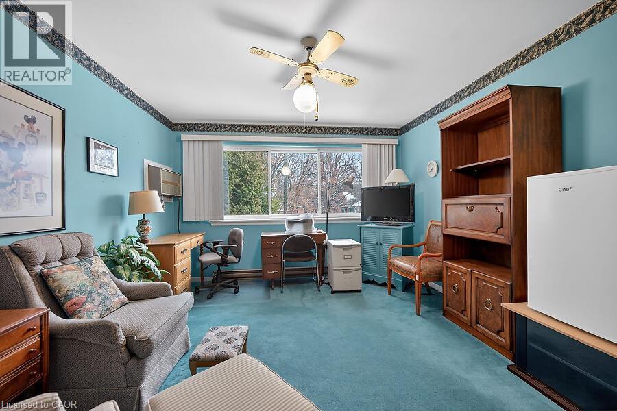 Office featuring a ceiling fan and dark colored carpet - 9 Daleview Court, Hamilton, ON - Indoor Photo Showing Living Room