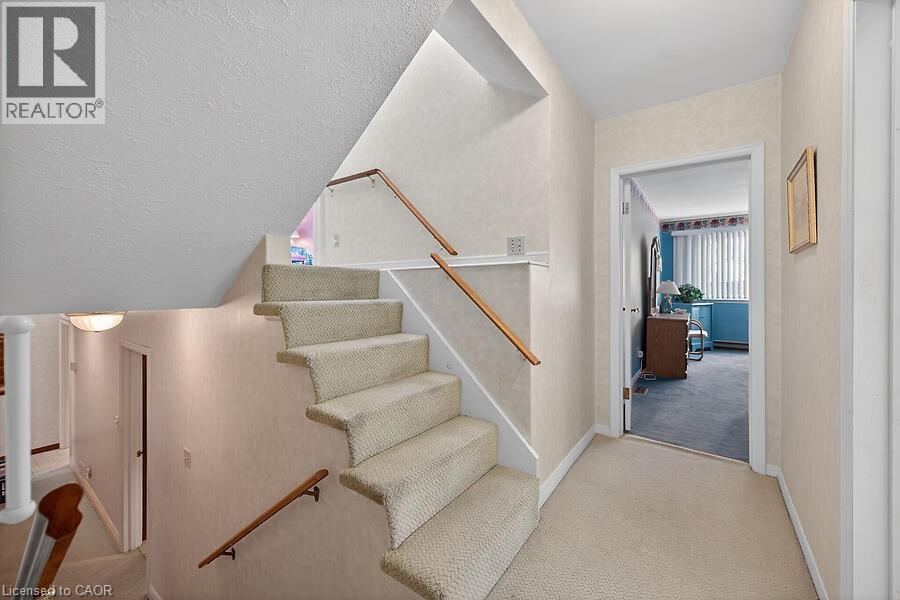 Stairway featuring carpet and a textured ceiling - 9 Daleview Court, Hamilton, ON - Indoor Photo Showing Other Room