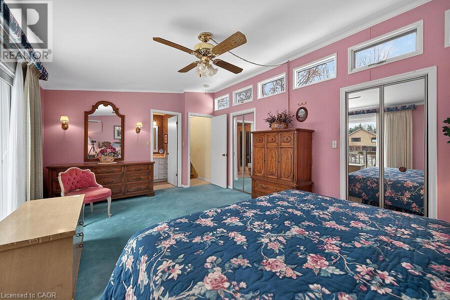 Bedroom with a closet, carpet, ceiling fan, and crown molding - 9 Daleview Court, Hamilton, ON - Indoor Photo Showing Bedroom