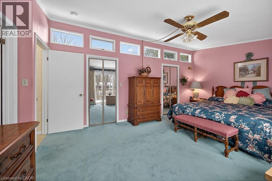 Bedroom with ceiling fan, light colored carpet, access to outside, and ornamental molding - 9 Daleview Court, Hamilton, ON - Indoor Photo Showing Bedroom