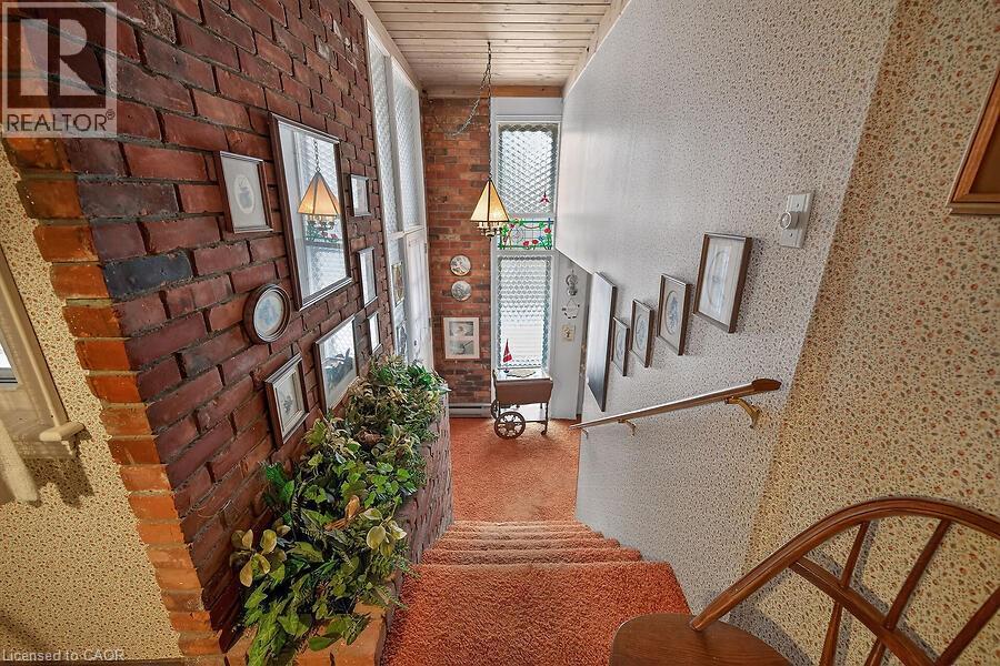 Stairs featuring wooden ceiling - 9 Daleview Court, Hamilton, ON - Photo Showing Other Room