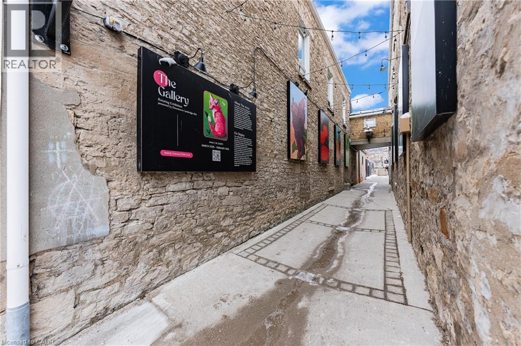 View of property exterior with stone siding - 26 Main Street, Cambridge, ON