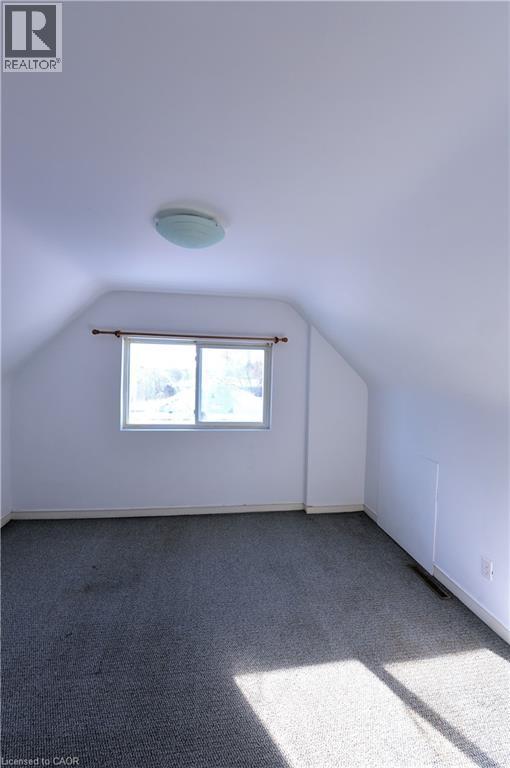Bonus room with lofted ceiling and carpet flooring - 1448 Upper Ottawa Street, Hamilton, ON - Indoor Photo Showing Other Room