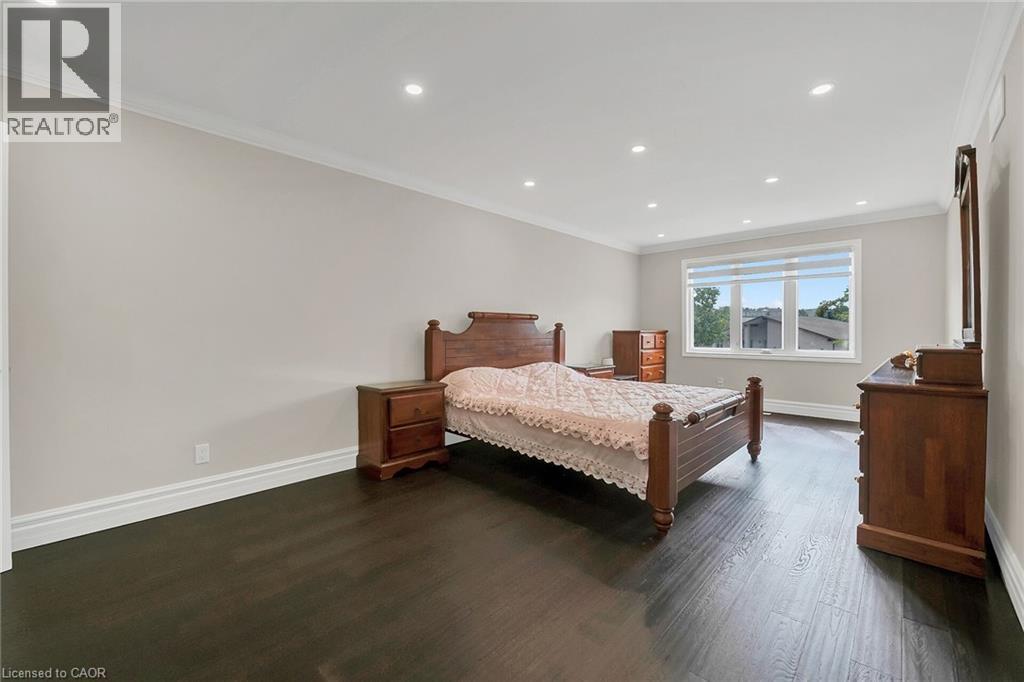 Bedroom featuring crown molding, recessed lighting, and dark wood-type flooring - 125 Valera Drive, Hamilton, ON - Indoor Photo Showing Bedroom