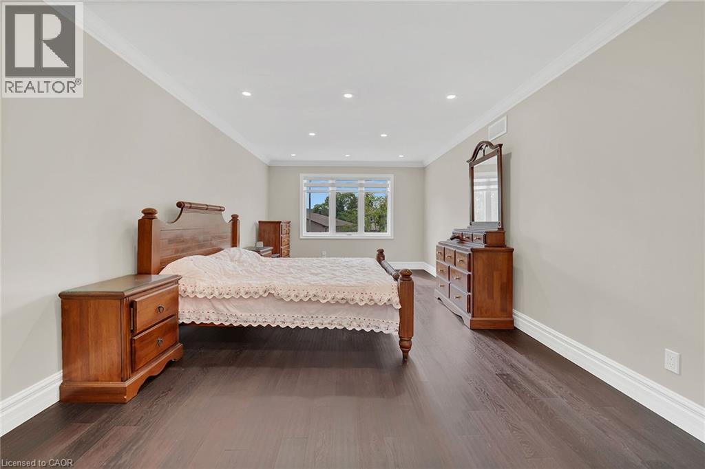 Bedroom featuring crown molding, dark wood finished floors, and recessed lighting - 125 Valera Drive, Hamilton, ON - Indoor Photo Showing Bedroom