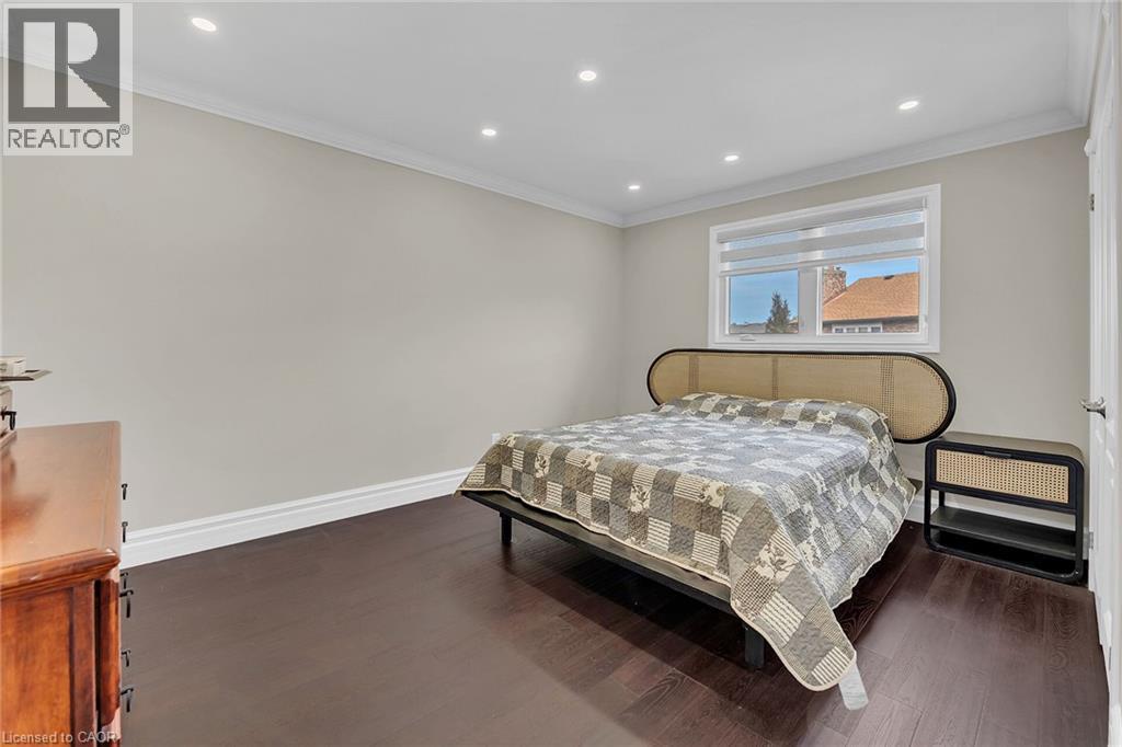 Bedroom featuring ornamental molding, recessed lighting, and dark wood finished floors - 125 Valera Drive, Hamilton, ON - Indoor Photo Showing Bedroom