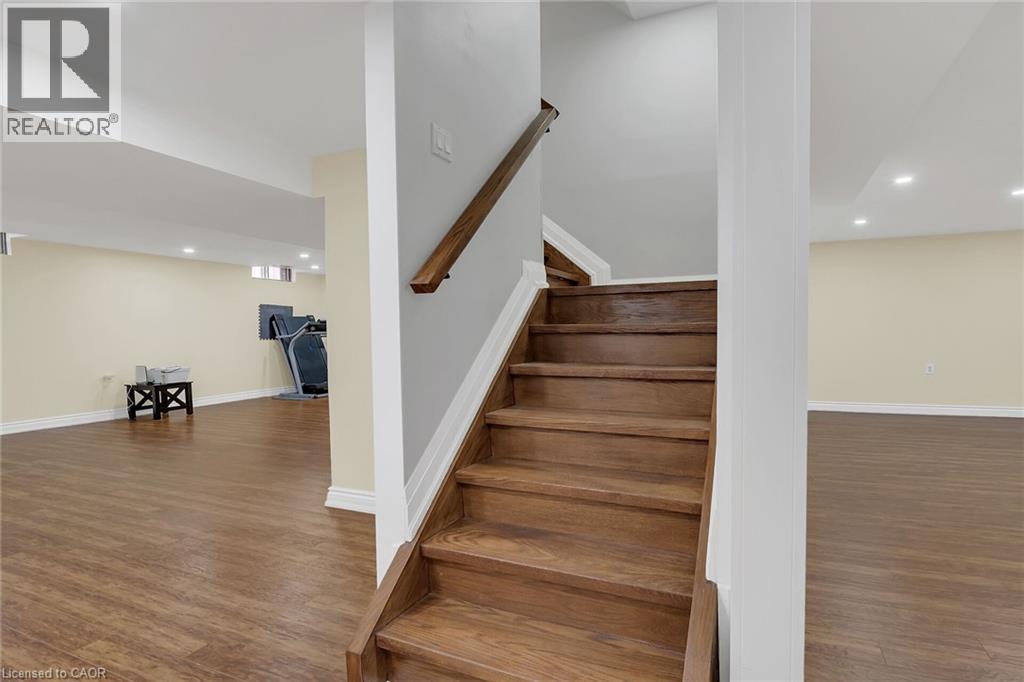 Staircase featuring recessed lighting and wood finished floors - 125 Valera Drive, Hamilton, ON - Indoor Photo Showing Other Room