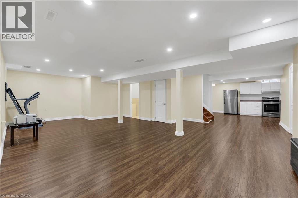 Workout area featuring recessed lighting and dark wood finished floors - 125 Valera Drive, Hamilton, ON - Indoor