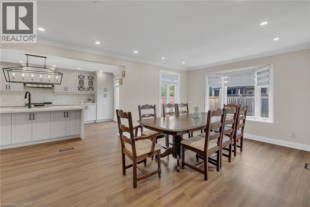 Dining room with crown molding, recessed lighting, and light wood-style flooring - 125 Valera Drive, Hamilton, ON - Indoor Photo Showing Dining Room