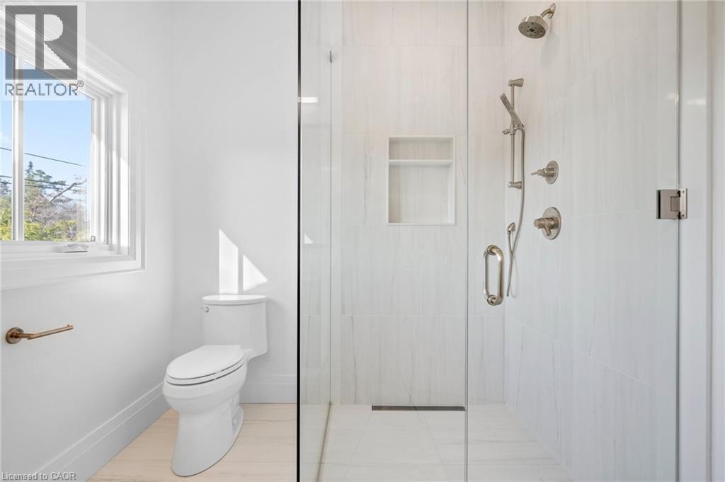 Bathroom with a shower stall and tile patterned floors - 1322 Minaki Road, Mississauga, ON - Indoor Photo Showing Bathroom