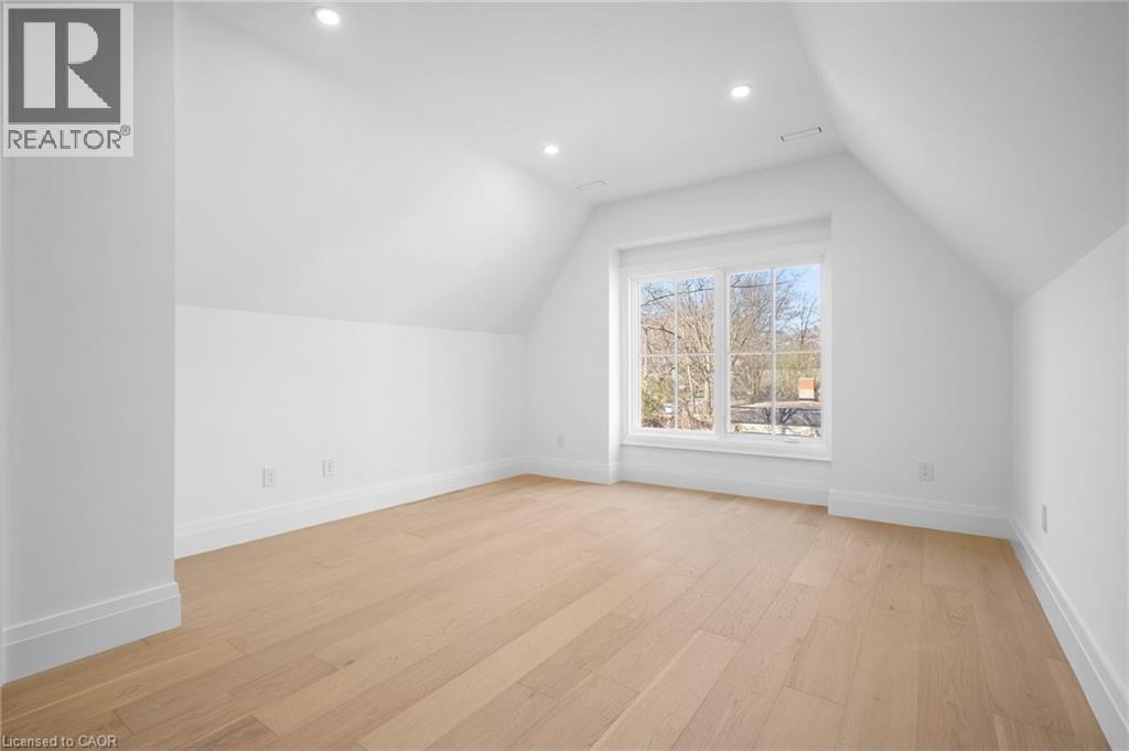Bonus room featuring light wood-style floors, vaulted ceiling, and recessed lighting - 1322 Minaki Road, Mississauga, ON - Indoor Photo Showing Other Room