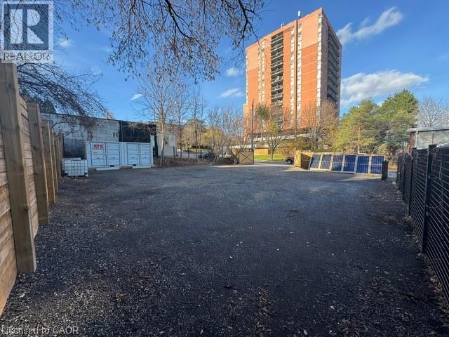 View of car parking featuring mail area - 43 Glen Road, Hamilton, ON