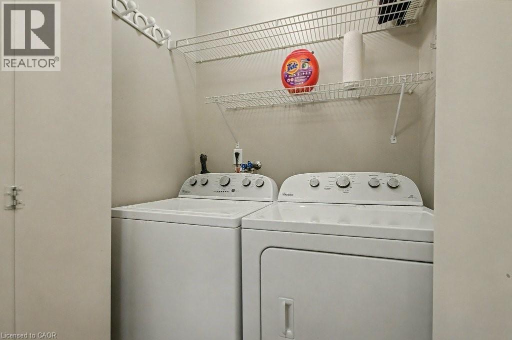 Laundry area featuring washer and dryer - 165 Main Street E Unit# 9, Grimsby, ON - Indoor Photo Showing Laundry Room