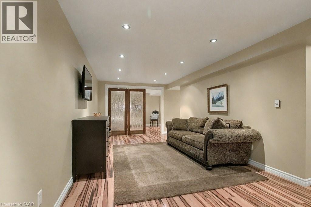 Living area featuring recessed lighting, light wood-style flooring, and french doors - 165 Main Street E Unit# 9, Grimsby, ON - Indoor