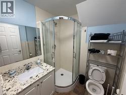 Bathroom with vanity and a shower stall -