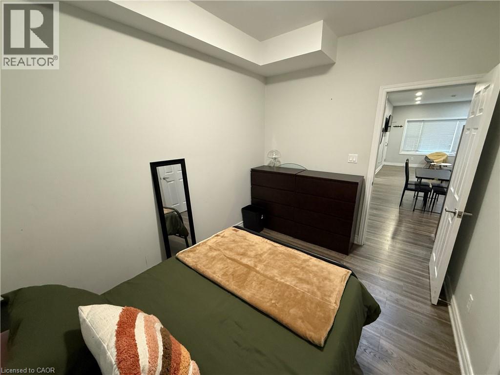 Bedroom featuring wood finished floors and baseboards - 106 Spadina Avenue Unit# 1, Hamilton, ON - Indoor